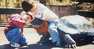 Kids playing on a fake turtle at the Baltimore Zoo
